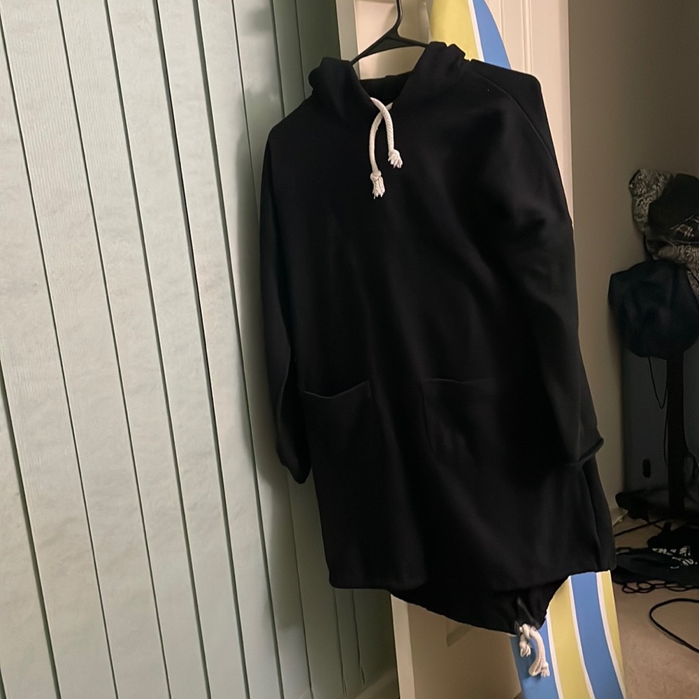 That is a sweatshirt. It is long and very black.